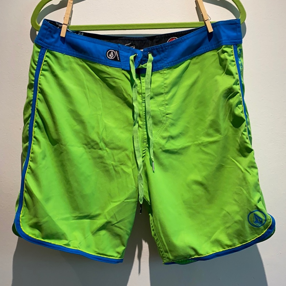 Men’s Volcom board shorts electric lime green.